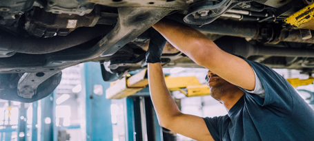 Aviron Technical Institute of Montreal Student Mechanic working under a car